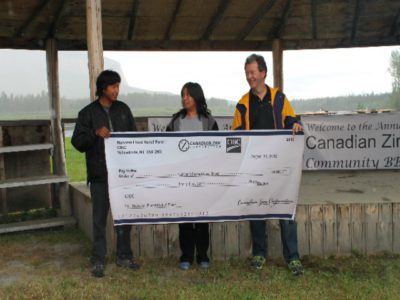 Alan Taylor presents Nahanni Flood Relief Fund cheque to Chief Clayton and Councillor Tammy Matou